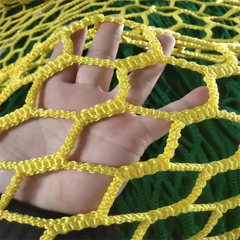 Yellow knotless netting held in hand, supplier product photo