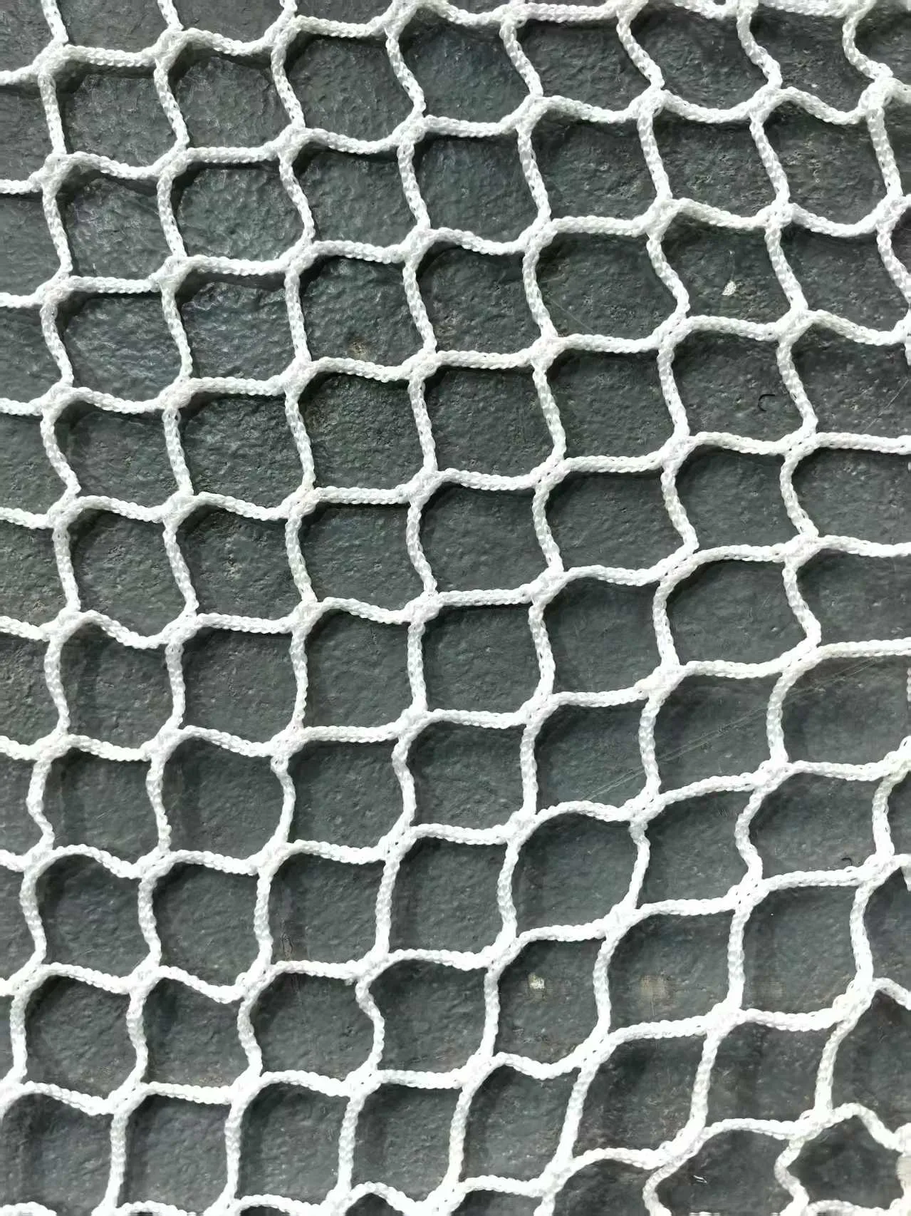 White polyester netting, 30 mm mesh, 3 mm twine, factory close-up